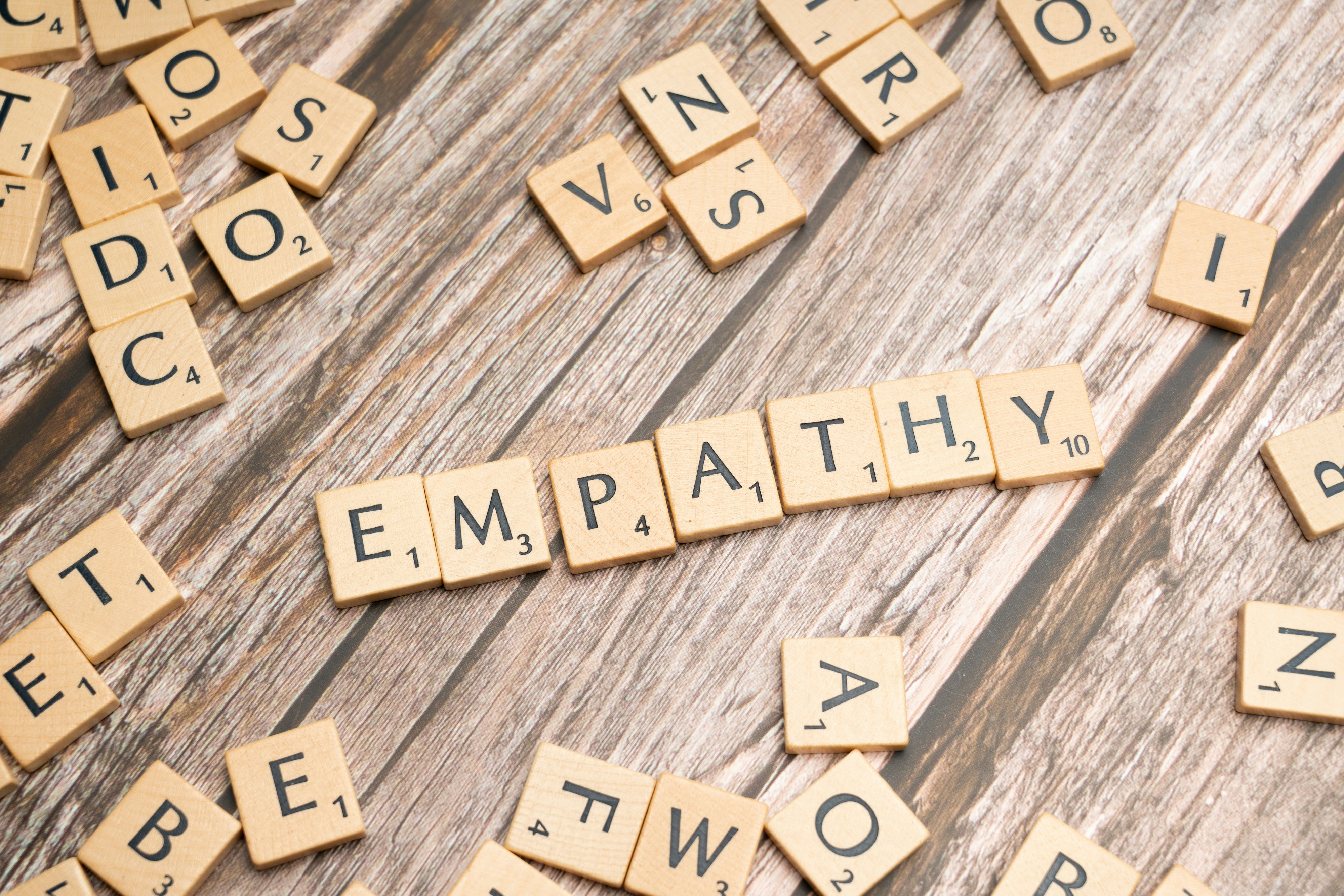 Scrabble letter tiles spelling out the word 'empathy'
